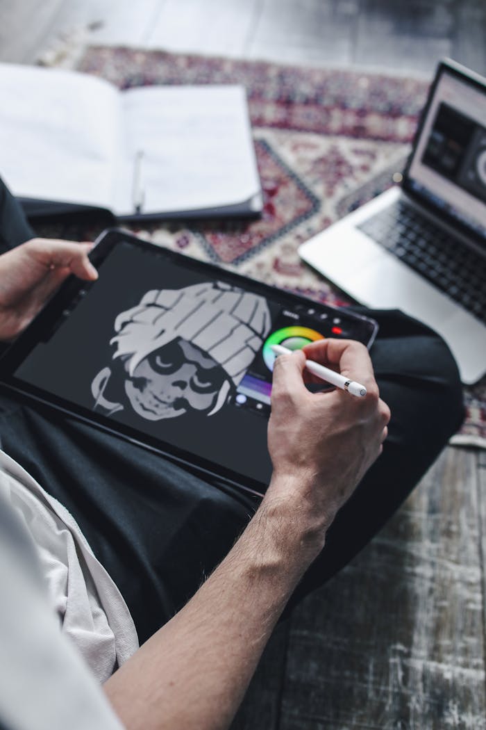 brand-01 Close-up of an artist drawing on a digital tablet using a stylus pen.